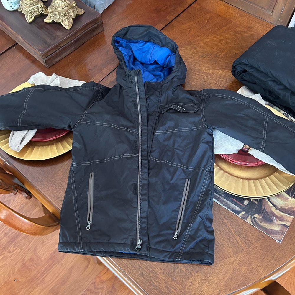 White Sierra Black ski Jacket with Blue Lining. Water resistant